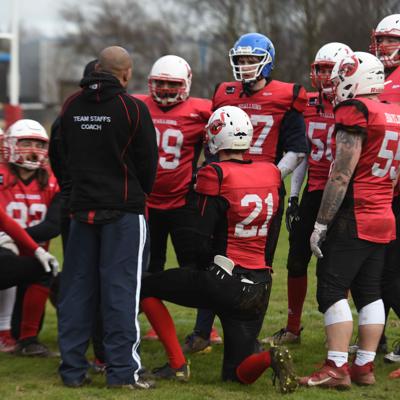 Staffs offensive team take a break to listen to their coach