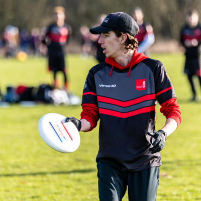 Staffs player looks down the field to make a pass in the match