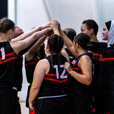 The Staffs Scorchers raise their arms in a circle to make a team shout