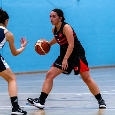 Staffs point guard number 7 looks to make a drive through Oxfords backcourt defenders