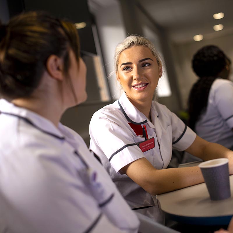 Nursing students enjoying a chat over a hot drink